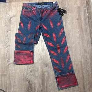 Baby phat low rise jeans
New with tags
Size 9 
Cuffed bottom blue jeans with red